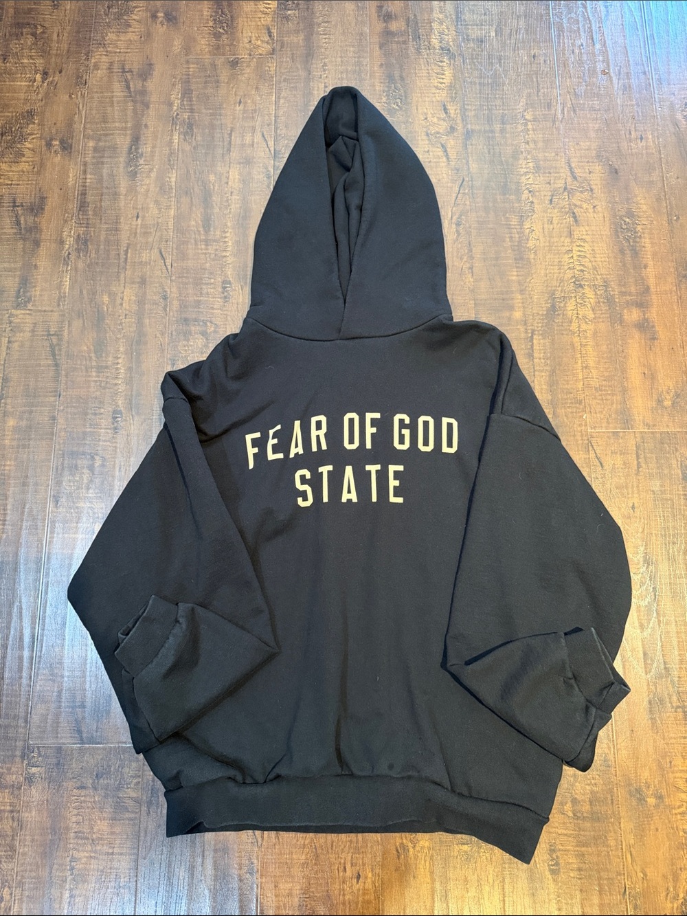 Fear of God Black Hoodie with Cream Lettering